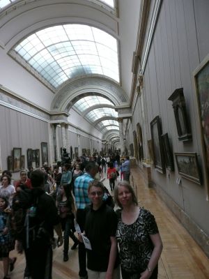 Image of people looking at art.
